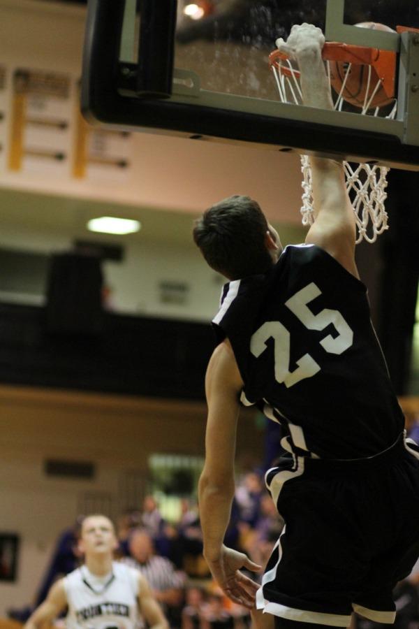 Cole throws down a one-handed slam against Frontier.