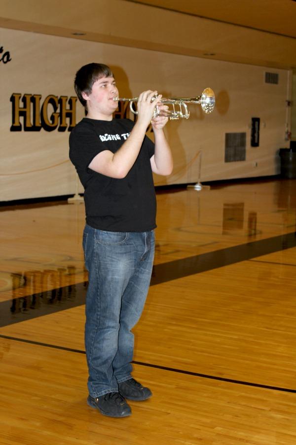 Sophomore Jared Lafond plays the National Anthem at the boys basketball sectionals