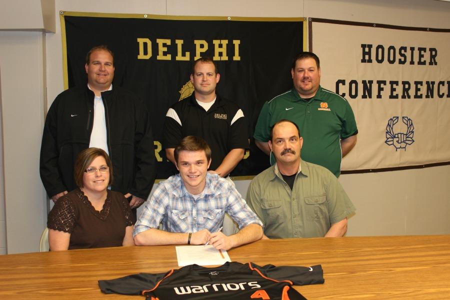 Sterrett+signing+National+Letter+of+Intent+alongside+family+and+coaches.+
