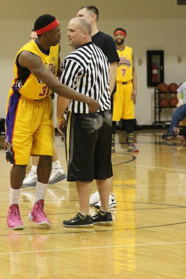 Giving a pep talk to the ref before the start of the game. 