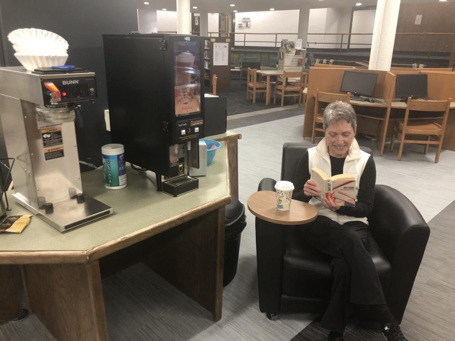 Mrs. Lawton reads and sips some coffee in one of the lounge chairs that was bought with coffee money. You can buy a coffee for $1 in the LMC.
