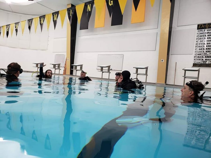 Students of the Indy Dive Center listen to their instructor. The DCHS pool is now a training ground for soon to be certified scuba divers.