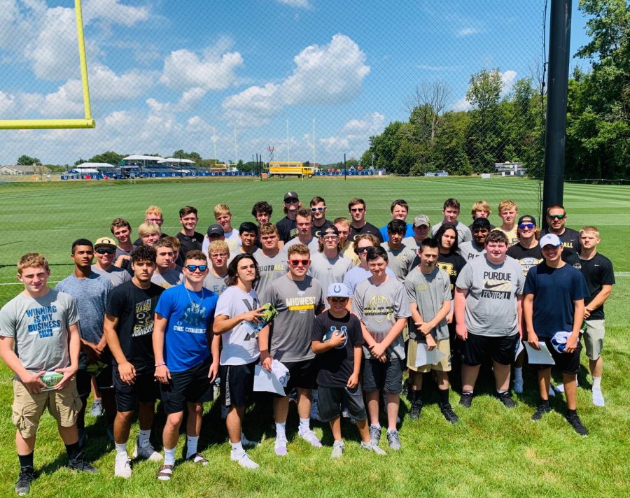 The Oracle football team poses for a picture at the Colts practice facility.