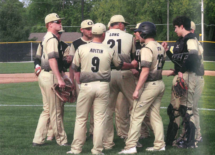 The 2019 DCHS baseball team gathers for a team huddle. Last year, the team won sectionals and hopes to achieve even more success with the addition of middle school feeder programs run by Varsity Coach Long.