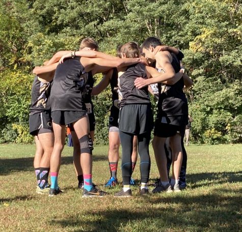The Oracles boys cross country team gets themselves into the right head space moments before running the sectional meet race.
